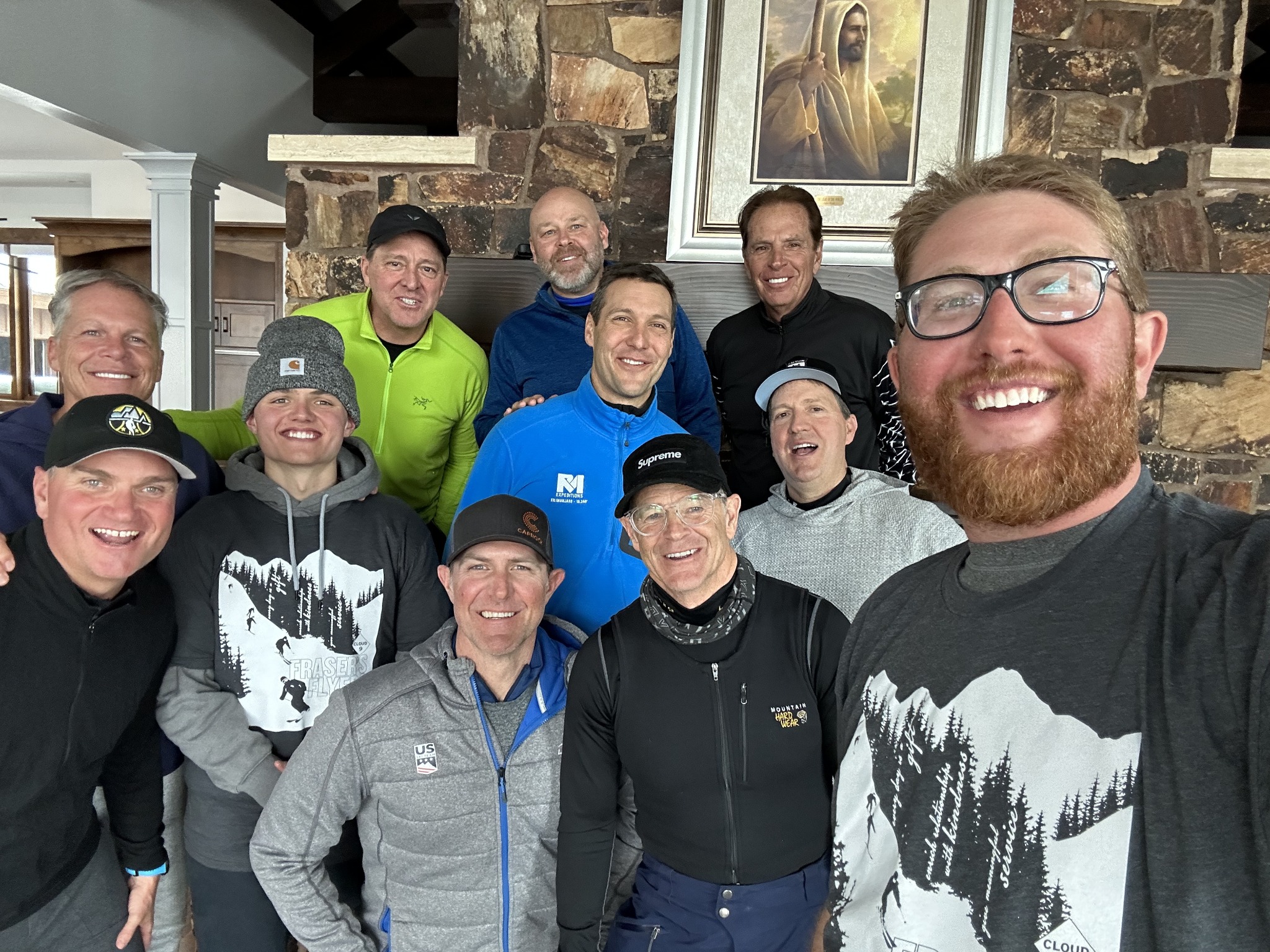 Carl smiling with a group indoors