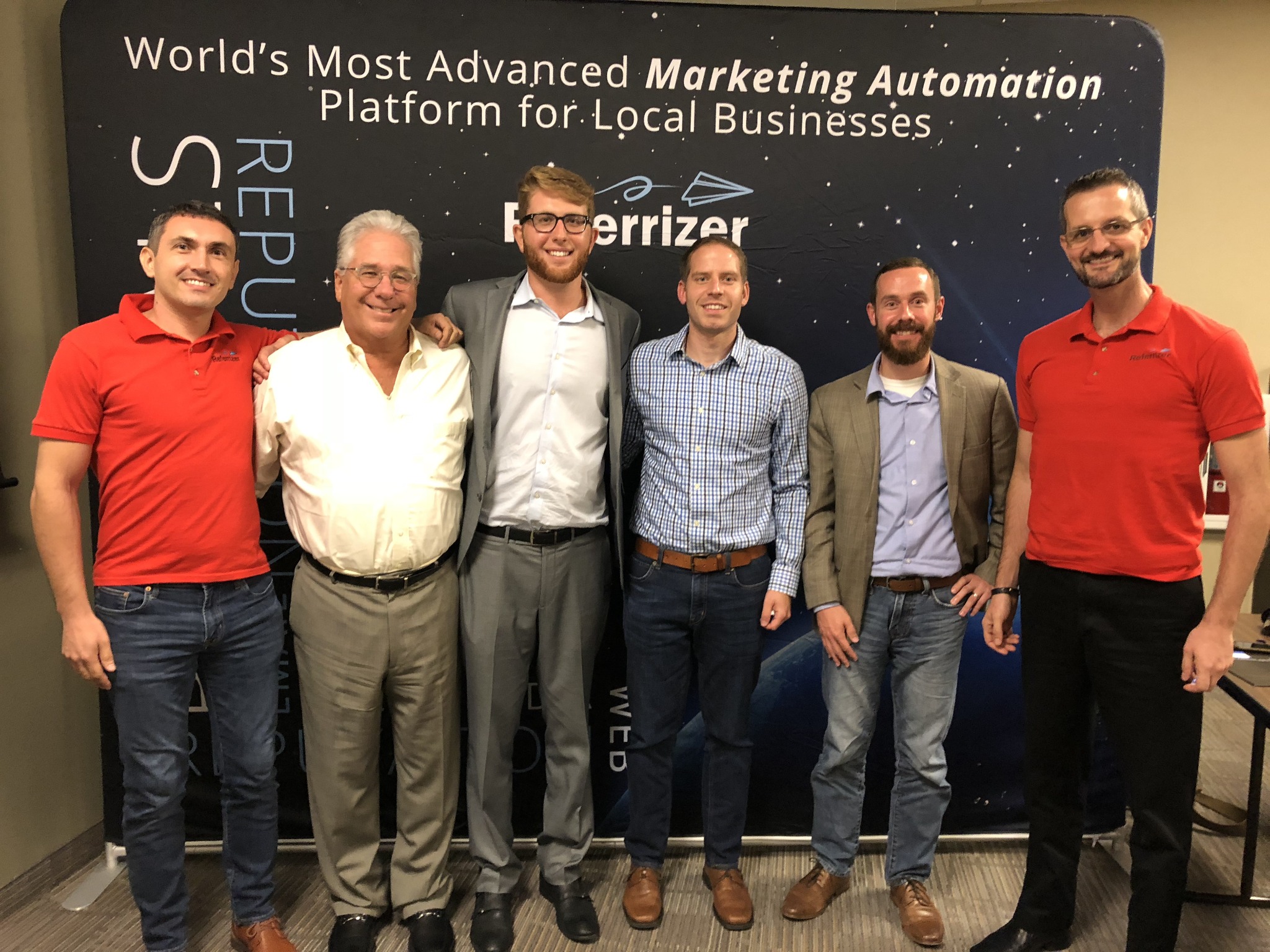 Carl Case with a group at a Referrizer booth